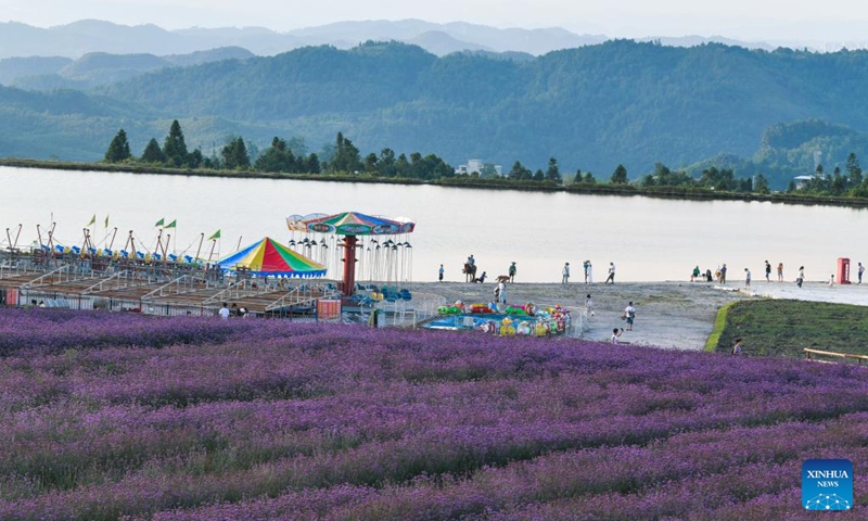 Tourists tour the Zimei Lake scenic spot in Jinxing Village, Longshan Town, Longli County, southwest China's Guizhou Province, July 25, 2024. During summer vacation, Longli County has become a popular destination for tourists to escape the sweltering summer heat. In recent years, local authorities have promoted the upgrading of the rural tourism, which attracts more tourists to visit. Photo: Xinhua