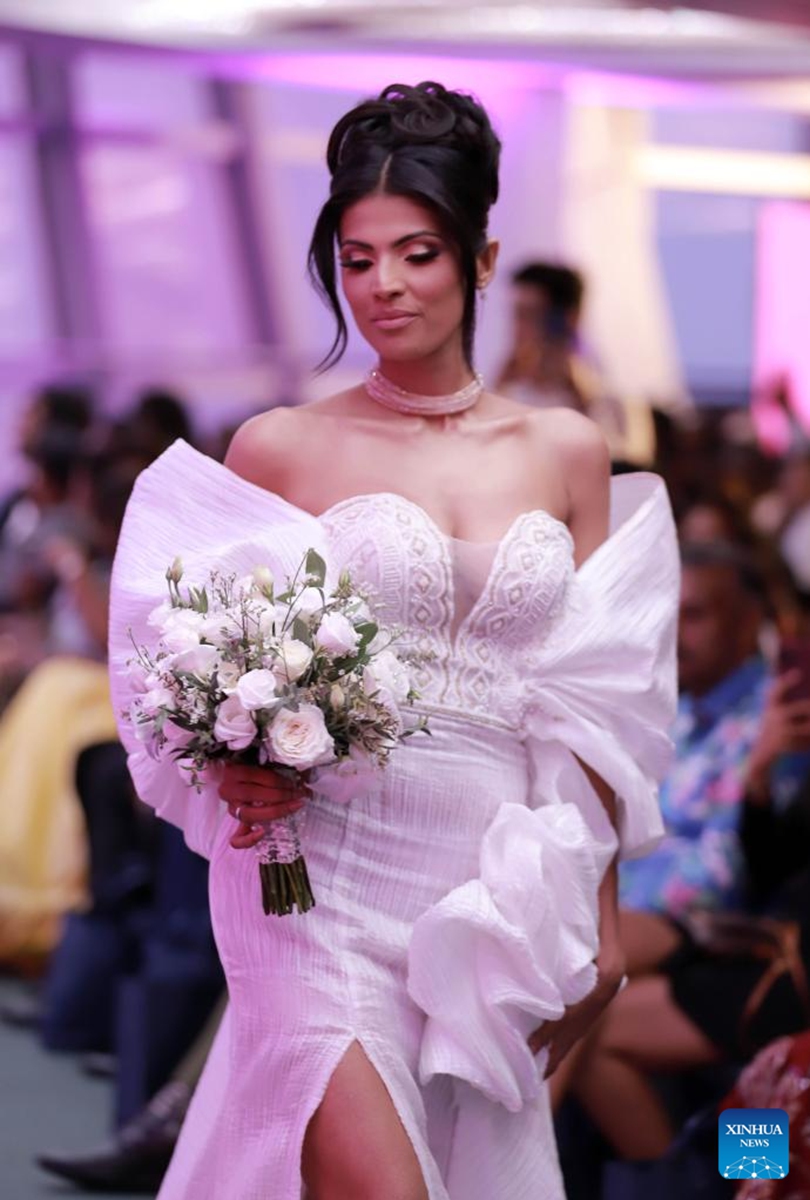 A model presents a bridal creation at the Designer Wedding Show 2024 at Lotus Tower in Colombo, Sri Lanka, on July 28, 2024. Photo: Xinhua