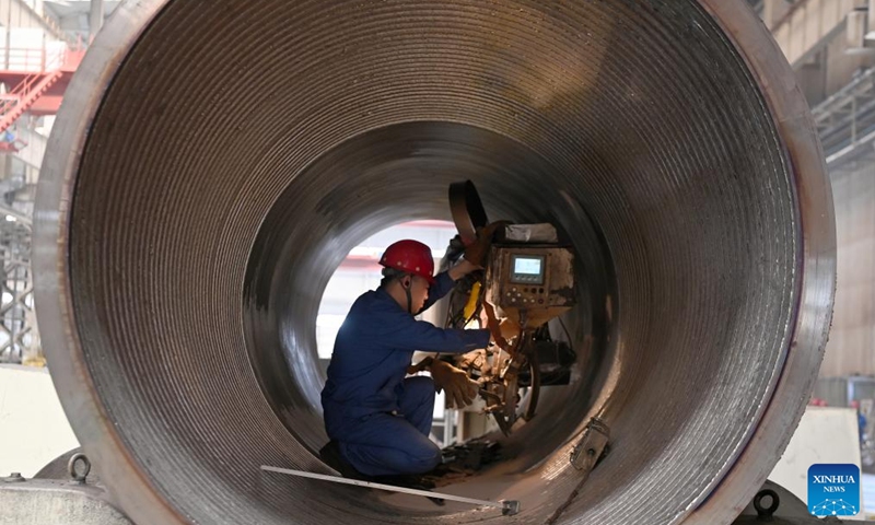 A worker welds in a workshop of LS Group High Tech Equipment Industrial Park of Lanzhou New Area in Lanzhou, northwest China's Gansu Province, July 25, 2024. In recent years, Lanzhou New Area has introduced 1,080 high-quality industrial projects with a total investment of 528 billion yuan (about $72.8 billion), and the annual increasing rate of industrial added value has maintained over 50 percent. From 2011 to 2023, the regional GDP of Lanzhou New Area has increased from less than 500 million yuan (about $69 million) to 37.5 billion yuan (about $5.2 billion). Photo: Xinhua