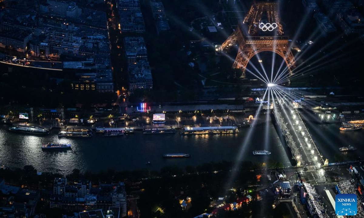 This photo taken from an helicopter on July 26, 2024 shows an aerial view of the delegation boats navigating down the Seine river near the illuminated Eiffel Tower during the opening ceremony of the Paris 2024 Olympic Games in Paris, France. Photo: Xinhua