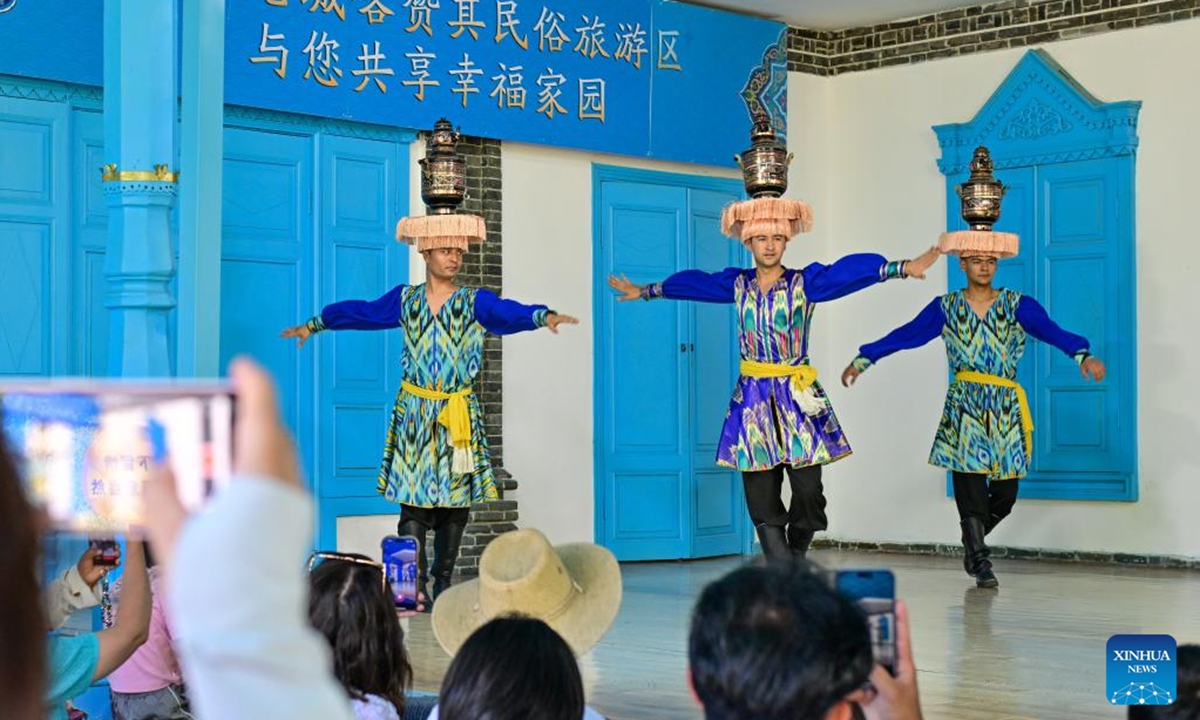 Tourists enjoy a performance in the Kazanqi folk tourism area in Yining City, Ili Kazak Autonomous Prefecture, northwest China's Xinjiang Uygur Autonomous Region, July 27, 2024.

Xinjiang is experiencing a tourism boom this year. Covering approximately one-sixth of China's land area, Xinjiang boasts diverse and unique natural landscapes, as well as rich historical and cultural tourism resources.(Photo: Xinhua)