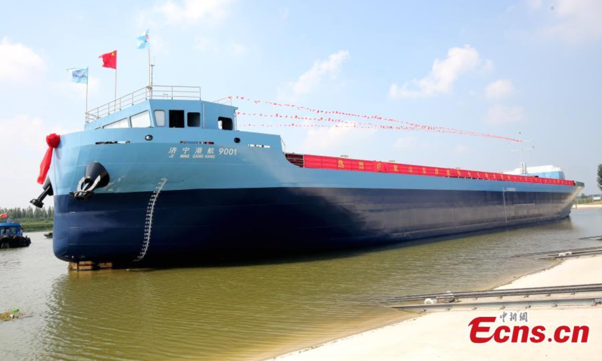 A new energy smart cargo ship, which will run along the Beijing-Hangzhou Grand Canal, is launched in Zoucheng, east China's Shandong Province, Aug 22, 2024. Photo:China News Service