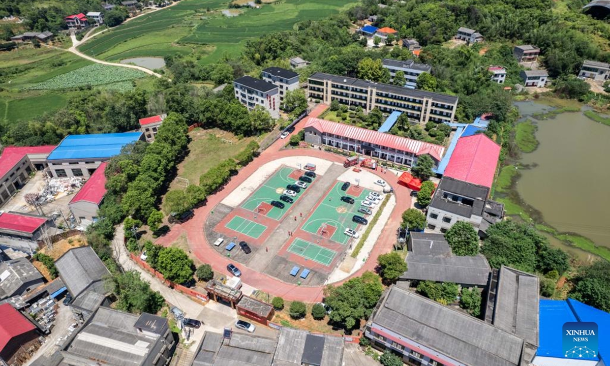 An aerial drone photo taken on July 30, 2024 shows a relocation site in a school in Xiangtan County, central China's Hunan Province. Heavy rainstorms in the aftermath of Typhoon Gaemi have wreaked havoc across Hunan. In Xiangtan County, three dike breaches occurred in the Juanshui River in the past few days, prompting the evacuation of thousands of residents. (Photo: Xinhua)