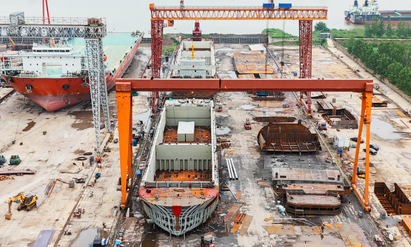 Workers repair and build ships at a shipyard in Lianyungang, East China's Jiangsu Province, on August 21, 2024. Lianyungang has promoted the development of the shipbuilding industry toward being intelligent and green. In the first half of 2024, shipbuilding enterprises in Lianyungang completed 99 ships of 236,000 deadweight tons, up 83 percent year-on-year. Photo: VCG