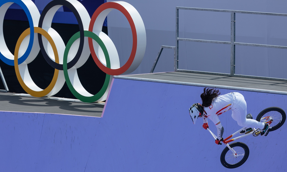 Deng Yawen, of China, performs a trick in front of a video screen during the cycling BMX freestyle women's park final at the 2024 Summer Olympics, July 31, 2024, in Paris, France. Photo: Li Hao/GT
