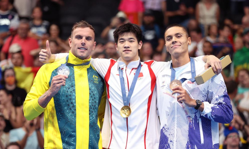 Gold medalist Pan Zhanle (center) of China, silver medalist Kyle Chalmers (left) of Australia and bronze medalist David Popovici of Romania pose during the victory ceremony for the men's 100m freestyle of swimming at Paris 2024 Olympic Games in Paris, France, on July 31, 2024. Photo: Xinhua