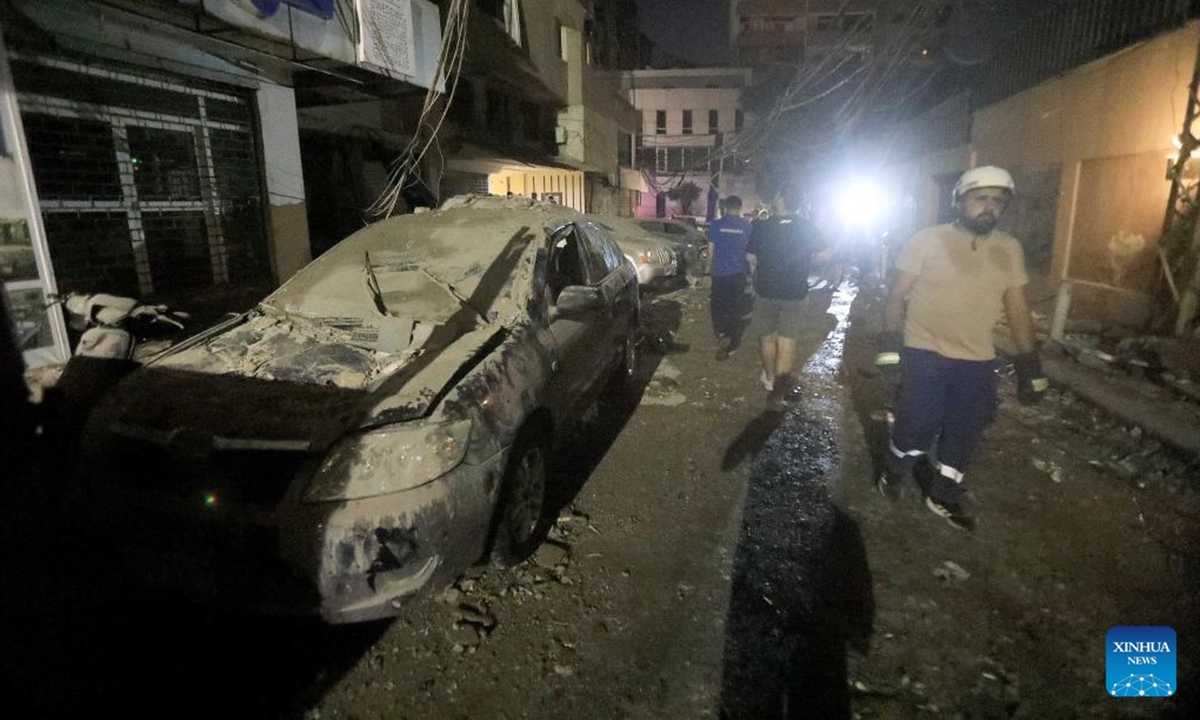 A vehicle at the roadside is seen damaged in an Israeli strike on a nearby building in the southern suburb of Beirut, Lebanon, on July 30, 2024. Israel's army announced on Tuesday that it killed Hezbollah's top military commander, Fouad Shokor, in an airstrike in Beirut, saying the assassination was a retaliation for a cross-border rocket that killed 12 youngsters on Saturday. (Photo: Xinhua)