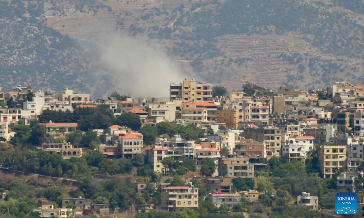 Smoke billows following Israeli artillery shelling in Lebanese town of Khiam, as seen from Marjeyoun, Lebanon, on Aug 22, 2024. Israeli warplanes and drones carried out 12 airstrikes on 10 Lebanese border towns and villages during the dawn and morning hours, according to Lebanese military sources. Photo:Xinhua