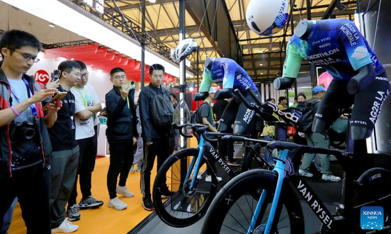 People visit the booth of VAN RYSEL during the 32nd China International Bicycle Fair in East China's Shanghai on May 5, 2024. The event kicked off here on the same day, drawing about 1,460 enterprises to participate. Photo: Xinhua