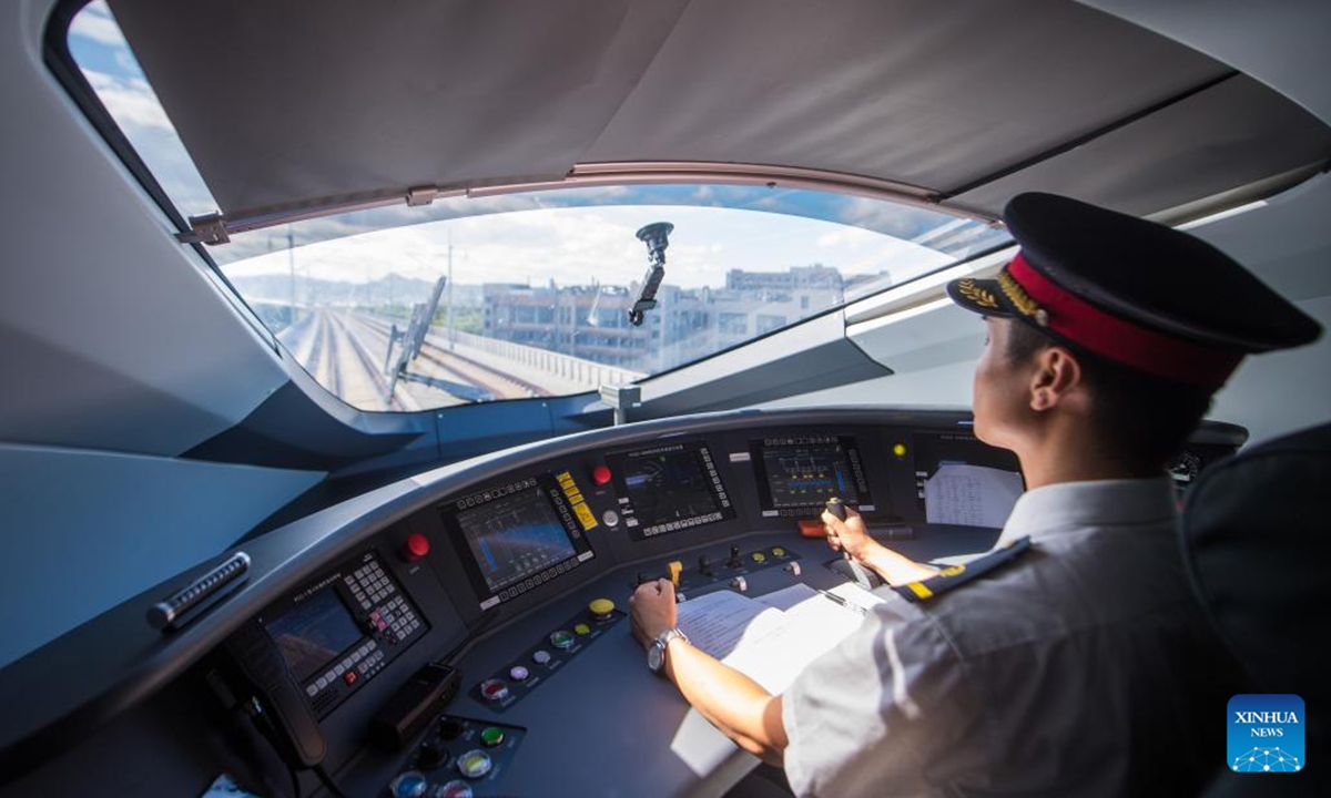 A bullet train driver works on the trial bullet train G55701 on the new high-speed railway linking Hangzhou and Wenzhou in east China's Zhejiang Province, July 30, 2024. A new high-speed railway went into trial operation on Tuesday linking two economic heavyweights of Hangzhou and Wenzhou cities in east China's Yangtze River Delta region. (Photo: Xinhua)