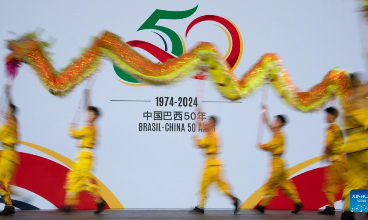 A dragon dance is staged at a reception celebrating the 50th anniversary of the establishment of diplomatic relations between China and Brazil in Brasilia, capital of Brazil, Aug. 15, 2024. (Photo: Xinhua)