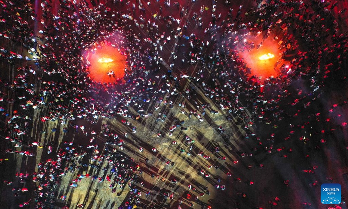 An aerial drone photo taken on July 29, 2024 shows people celebrating the annual torch festival of Yi ethnic group in Weining County, southwest China's Guizhou Province. (Photo: Xinhua)