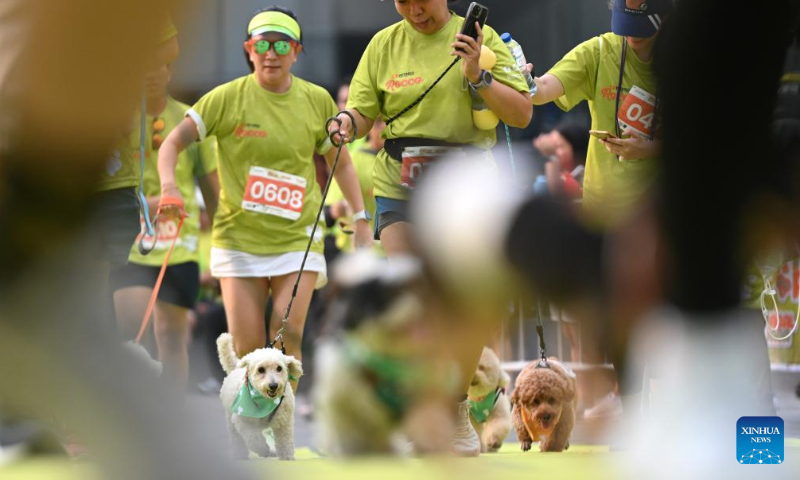 Dogs and their owners attend Bark Day Fun Run at Senayan Park in Jakarta, Indonesia, on Aug. 11, 2024. This event aims to call for more attention to the welfare of dogs and stop the dog meat trade. (Photo: Xinhua)