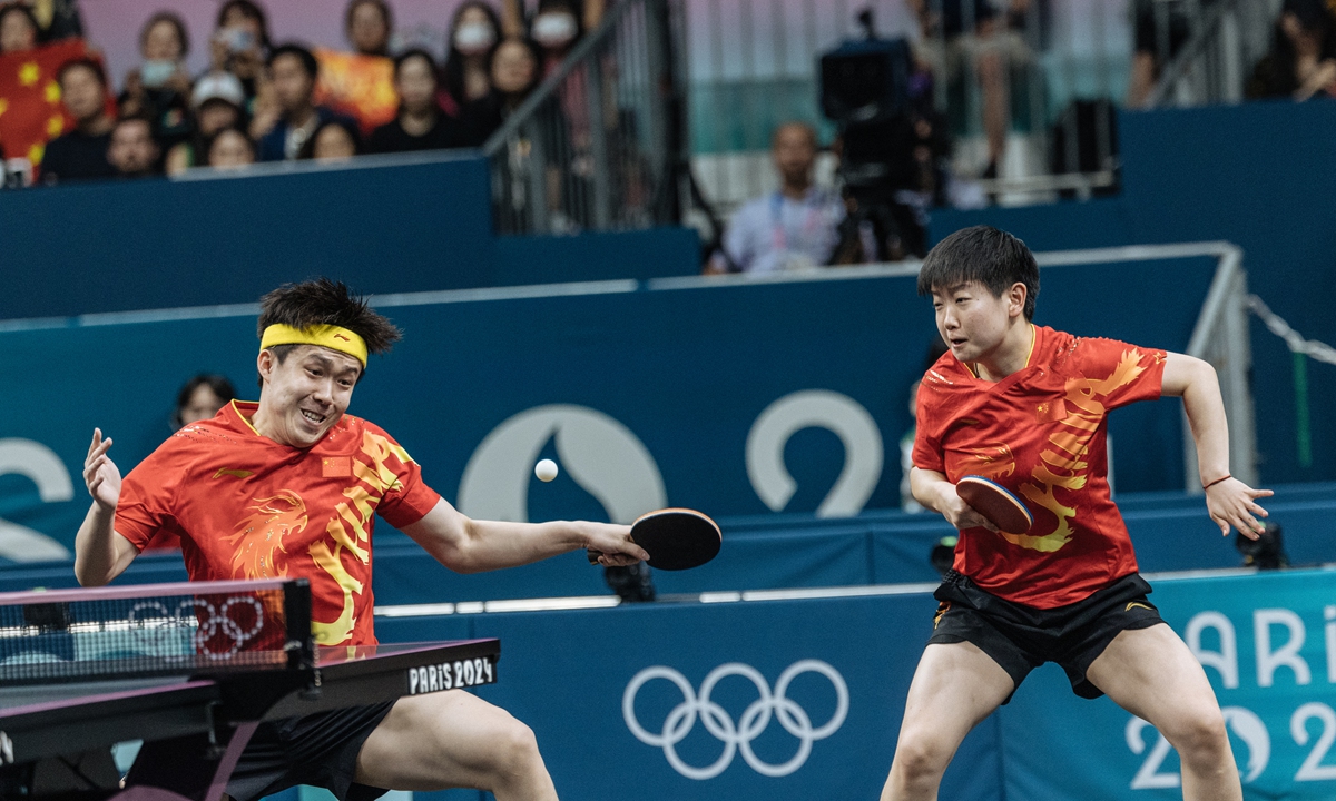 China's Wang Chuqin (left) and Sun Yingsha competes in the tabel tennis <strong></strong>mixed doubles final at the Paris Olympics on Tuesday. Photo: Li Hao/GT