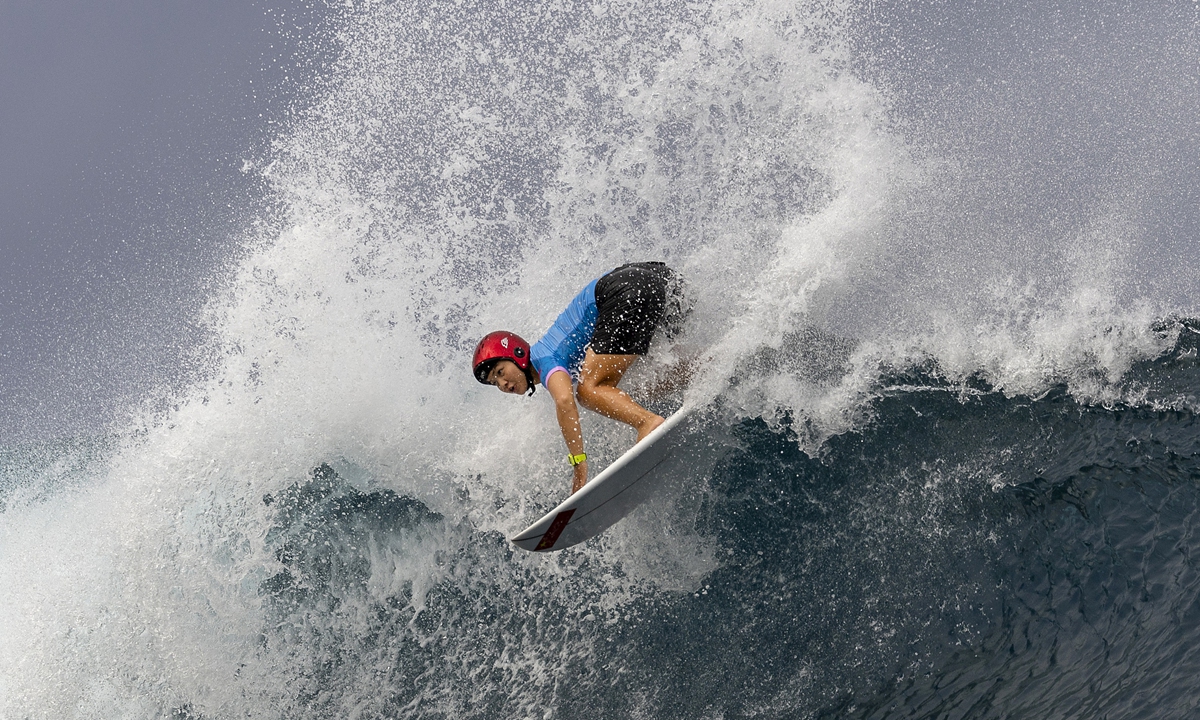 Yang Siqi of China rides a wave, during round two on day two of the women's surfing competition, at the 2024 Summer Olympics, Sunday, July 28, 2024, in Teahupo'o, French Polynesia. Photo: VCG