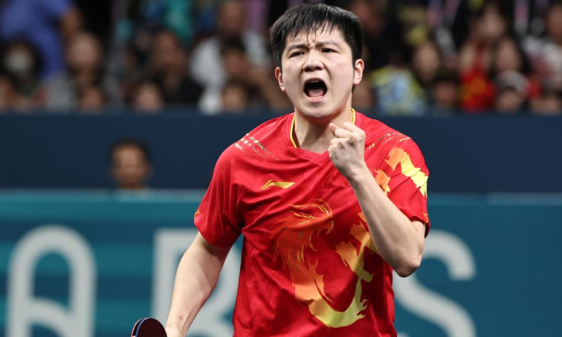 Fan Zhendong of China reacts during the men's singles gold medal match of table tennis between Truls Moregard of Sweden and Fan Zhendong of China at the Paris 2024 Olympic Games in Paris, France, on August 4, 2024. Photo: Xinhua/Wang Dongzhen