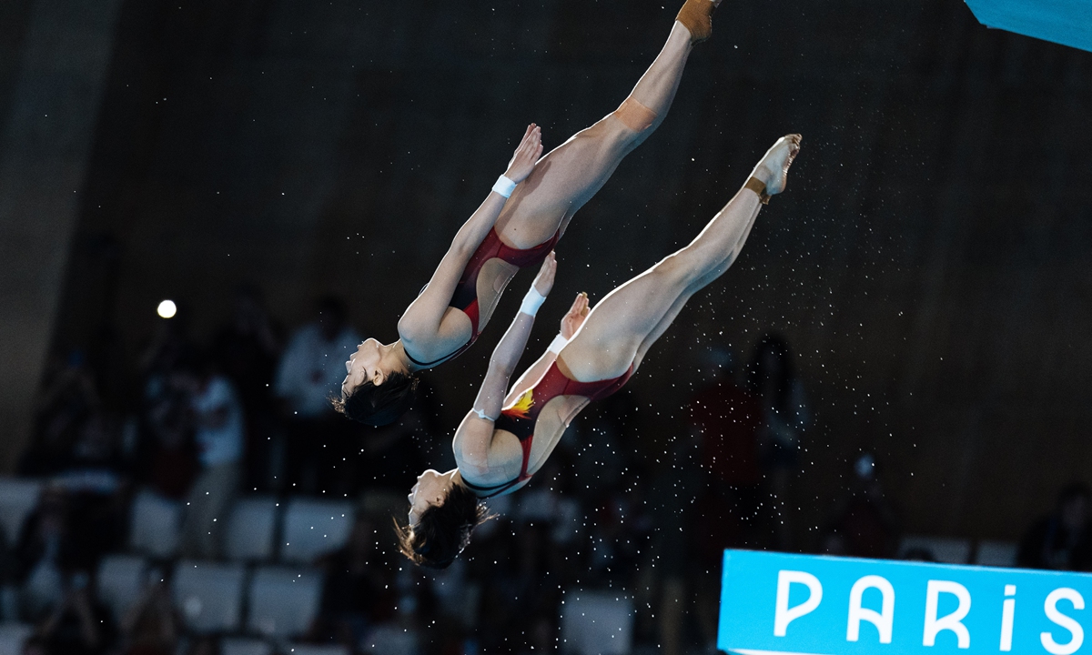 Chinese divers Quan Hongchan and Chen Yuxi compete in the women's synchronized 10-meter platform diving final at the Paris Olympic Games on July 31, 2024. They are now both two-time Olympic gold medallists. The duo won the Chinese diving team's third gold from three so far at the Paris Olympics. Photo: Li Hao/GT