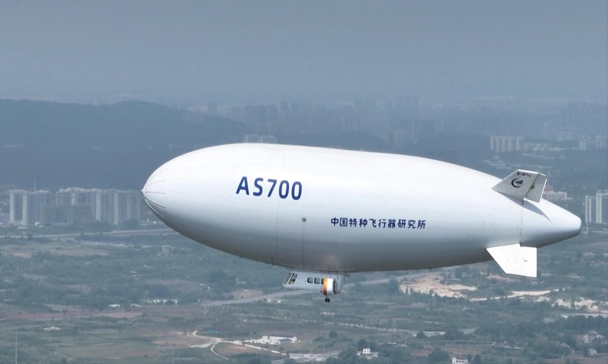 China's first self-developed civil airship, the AS700 Xiangyun, successfully completes its first demonstration flight in a low-altitude tourism application scenario in Jingmen, Central China's Hubei Province, on August 1, 2024. The flight marks a new stage in the industrial application of this technological innovation project. Photo: VCG