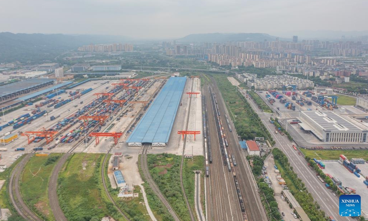 An aerial drone photo taken on July 30, 2024 shows the Tuanjiecun Station, Xinglongchang Station and dry port of the New International Land-Sea Trade Corridor (L-R) at the Chongqing International Logistics Hub Park in Shapingba District of Chongqing, southwest China. Chongqing International Logistics Hub Park, along with its 62 freight train routes, has risen to be a major hub of international freight trains in the country's western region. (Photo: Xinhua)