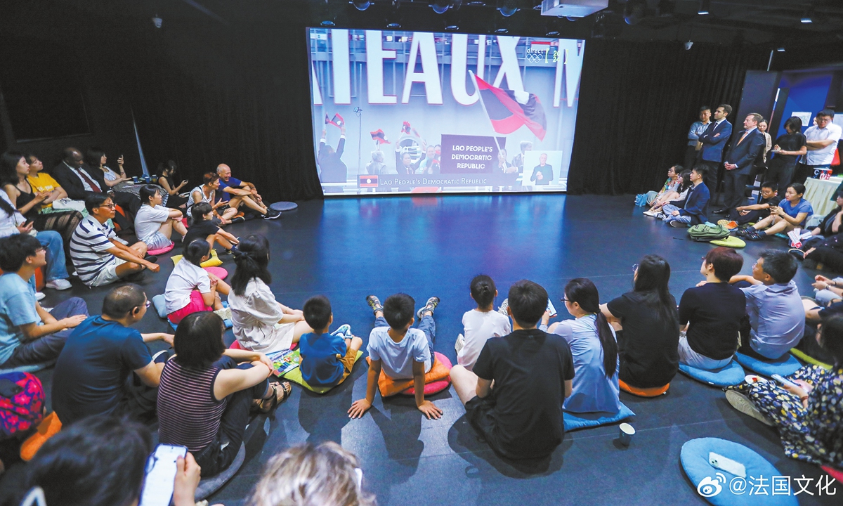 Audience watch the replay of the opening ceremony of the Paris 2024 in Beijing on July 26. Photo: Courtesy of Embassy of France in China