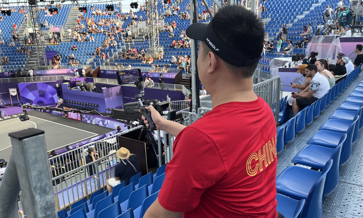 Zhang Mingxin collects video materials for AI analysis ahead of a basketball 3x3 game at Paris Olympics on August 1, 2024. Photo: Courtesy of Zhang