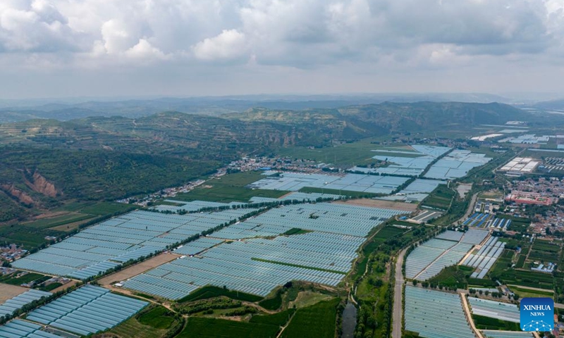 An aerial drone photo taken on Aug. 2, 2024 shows a vegetable planting base at Shatang Township in Guyuan City, northwest China's Ningxia Hui Autonomous Region. In recent years, Shatang Township has attached great importance to the development of facility agriculture, which adopted technologies including the earthworm biotechnology and straw biotechnology to increase vegetables production. Photo: Xinhua