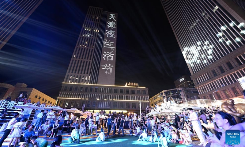 Visitors enjoy themselves during the 5th Tianjin Nighttime Life Festival in north China's Tianjin Municipality, Aug. 2, 2024. The 5th Tianjin Nighttime Life Festival began here on Friday night and will last about one month. People can enjoy night markets, music shows, sports games and art exhibitions during the festival. Photo: Xinhua