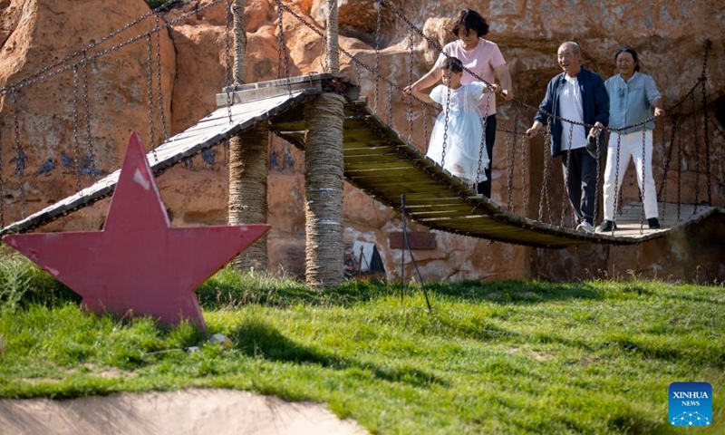 Tourists visit the Yangjiadian Village in Guyuan City, northwest China's Ningxia Hui Autonomous Region, Aug. 1, 2024. Relying on abundant red tourism resources of the Liupan Mountain, local authorities in Yangjiadian have actively developed homestay and rural tourism to advance rural revitalization. Photo: Xinhua