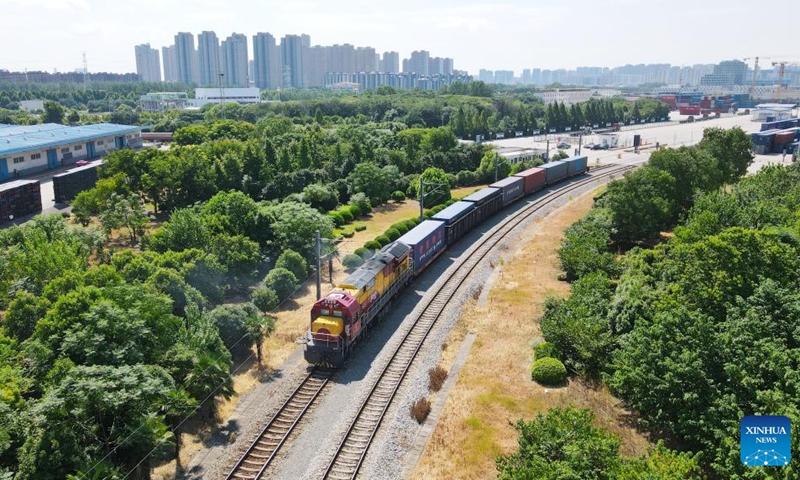 This aerial drone photo taken on Aug. 1, 2024 shows a China-Europe freight train departing from the logistics base of Hefei north railway station in Hefei, east China's Anhui Province. A total of 380 China-Europe freight trains departing from Hefei between January and July this year, marking a 3 percent increase from the previous year. Photo: Xinhua