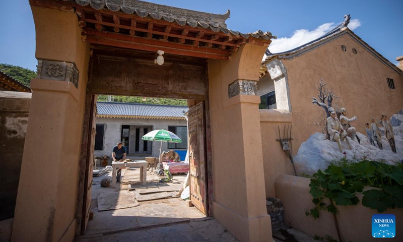 A villager renovates his homestay at the Yangjiadian Village in Guyuan City, northwest China's Ningxia Hui Autonomous Region, Aug. 1, 2024. Relying on abundant red tourism resources of the Liupan Mountain, local authorities in Yangjiadian have actively developed homestay and rural tourism to advance rural revitalization. Photo: Xinhua