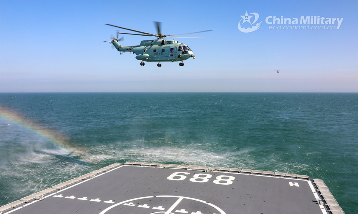 A ship-borne helicopter attached to a combat support ship flotilla under the PLA Navy conducts take-off and landing training during a multi-subject maritime training exercise on June 6, 2024. (eng.chinamil.com.cn/Photo by Yu Peng)