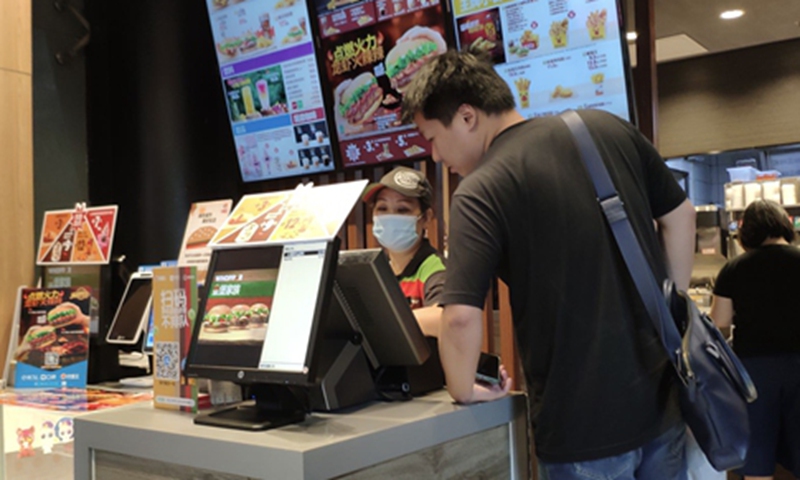 A consumer orders food at a branch of Burger King in Shanghai on Friday. Photo: GT