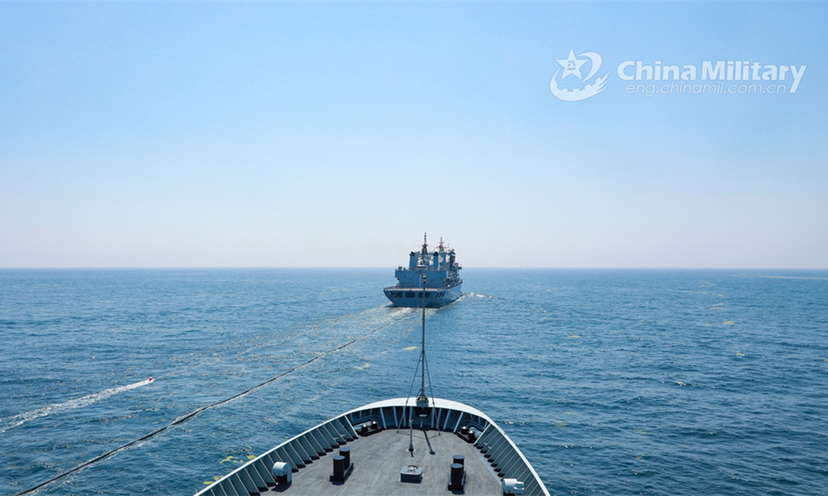 Vessels attached to a combat support ship flotilla under the PLA Navy conduct astern replenishment-at-sea during a multi-subject maritime training exercise on June 6, 2024. (eng.chinamil.com.cn/Photo by Li Qiutong)