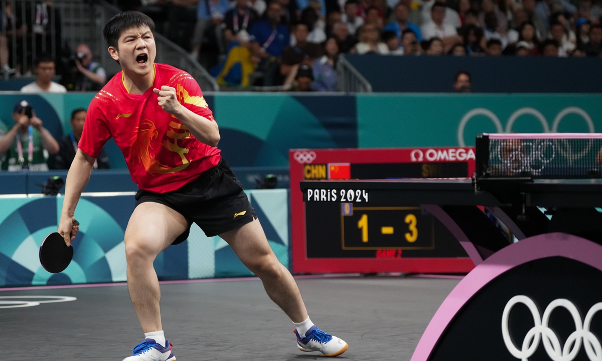 Chinese paddler Fan Zhendong defeats Truls Moregard of Sweden 4-1 to win the table tennis men's singles gold medal at the Paris Olympic Games on August 4, 2024. Photo: VCG
