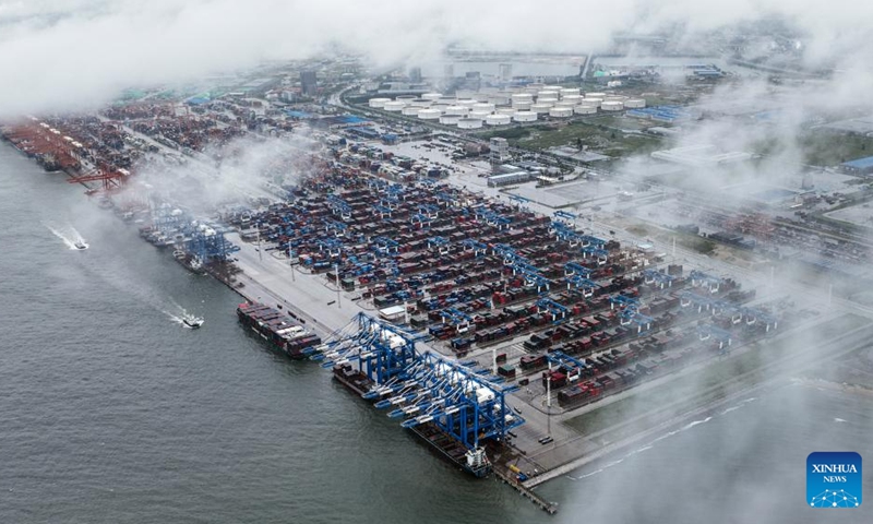 An aerial drone photo taken on July 31, 2024 shows a view of Qinzhou Port in Qinzhou, south China's Guangxi Zhuang Autonomous Region. As of Aug. 2 this year, more than 500,000 twenty-foot equivalent unit (TEU) containers for rail-sea intermodal transportation have been delivered via the New International Land-Sea Trade Corridor, the highest level for the same period in all years. The New International Land-Sea Trade Corridor, jointly built by provincial-level regions in western China and ASEAN members, expanded its reach to 490 ports across 120 countries and regions, according to data released in January by southwest China's Chongqing Municipality, the corridor's operational hub. Photo: Xinhua