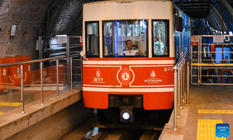 A train of the subway line Tünel arrives at a station in Istanbul, Türkiye, July 31, 2024. In 1875, the subway line with two wooden cars, powered by a steam engine, went into operation. The carriages were illuminated by oil lamps as there was no electricity at the time. The line is the second oldest in the world after the one built in 1863 in London. It covers a distance of 573 meters in 90 seconds. Photo: Xinhua