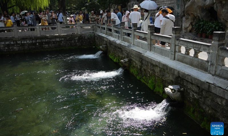 People visit the Heihu Spring in Jinan, east China's Shandong Province, Aug. 3, 2024. Dubbed the city of a thousand springs, Jinan boasts more than 1,200 natural springs. Photo: Xinhua