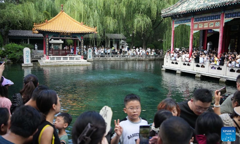 People visit the Baotu Spring in Jinan, east China's Shandong Province, Aug. 3, 2024. Dubbed the city of a thousand springs, Jinan boasts more than 1,200 natural springs. Photo: Xinhua