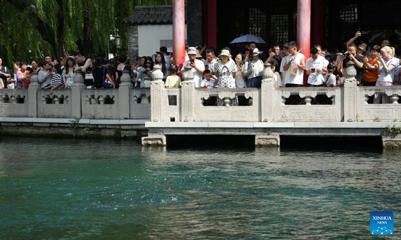 People visit the Baotu Spring in Jinan, east China's Shandong Province, Aug. 3, 2024. Dubbed the city of a thousand springs, Jinan boasts more than 1,200 natural springs. Photo: Xinhua