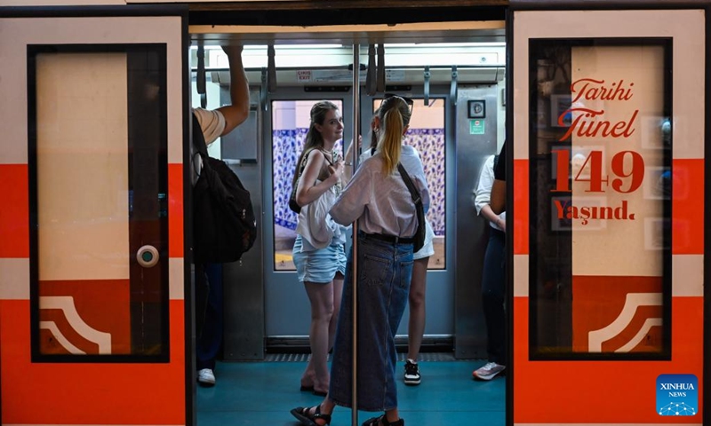 Passengers take the train of the subway line Tünel in Istanbul, Türkiye, July 31, 2024. In 1875, the subway line with two wooden cars, powered by a steam engine, went into operation. The carriages were illuminated by oil lamps as there was no electricity at the time. The line is the second oldest in the world after the one built in 1863 in London.It covers a distance of 573 meters in 90 seconds. Photo: Xinhua