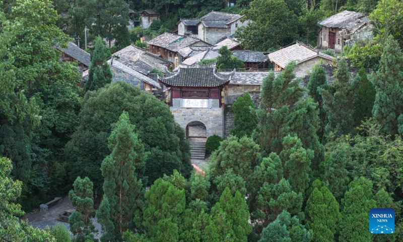 An aerial drone photo taken on July 23, 2024 shows a view of Yunshantun Village in Xixiu District of Anshun City, southwest China's Guizhou Province. In Anshun City, southwest China's Guizhou Province, ancient stone buildings and unique local traditions have made a cluster of villages popular tourist destinations for many visitors. The stone-structured Tunpu residential buildings were built in the Ming Dynasty (1368-1644), when some troops were sent to Anshun, where they built villages and turned the neighborhood into farmland for growing crops. Their descendants have lived there over generations, and formed the unique Tunpu culture which preserved distinctive customs, architectures, operas and costumes of ancient times. Photo: Xinhua