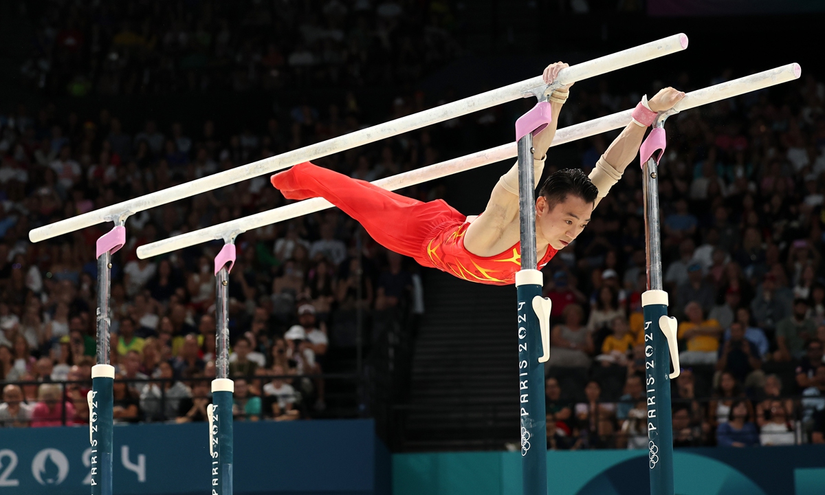 Zou Jingyuan of Team People's Republic of China competes during the Artistic Gymnastics Men's Parallel Bars Final on day ten of the Olympic Games Paris 2024 at Bercy Arena on August 05, 2024 in Paris, France.   Photo: VCG