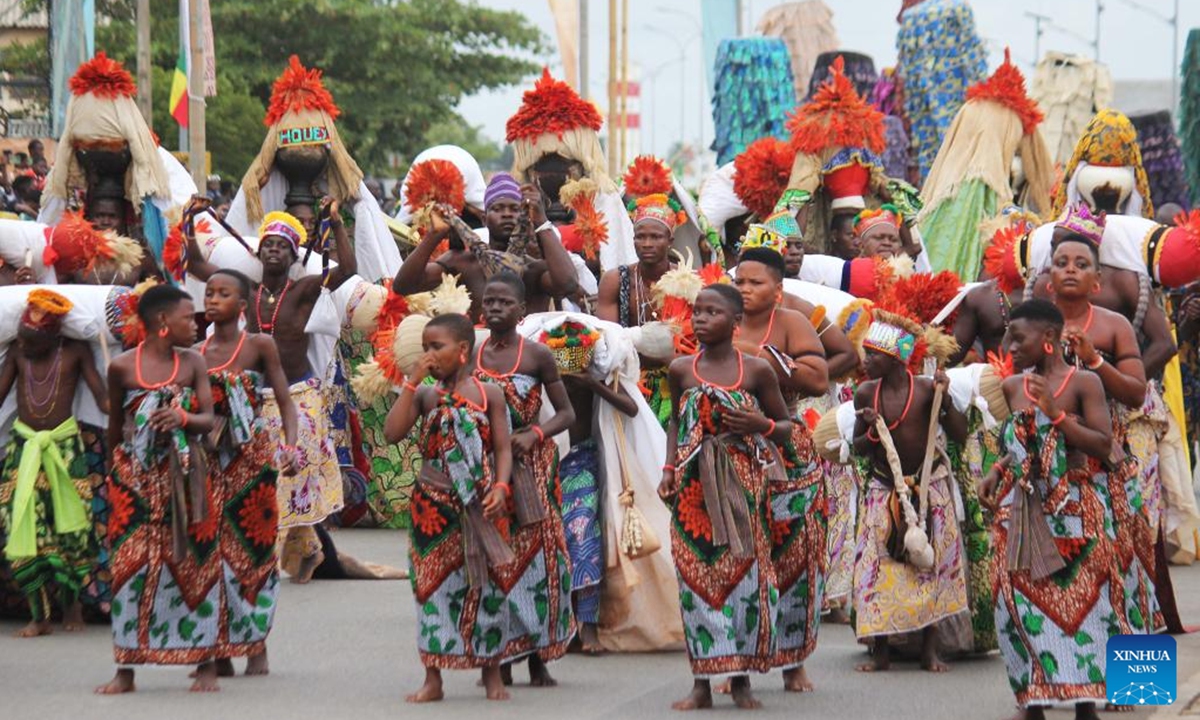 People in costumes perform in a mask parade during the Porto Novo Mask Festival in Porto Novo, Benin, Aug. 4, 2024. The festival was held here from Friday to Sunday to showcase the art and culture of Benin's traditional religion Vodun through a mask parade, concerts, seminars and other activities. (Photo: Xinhua)