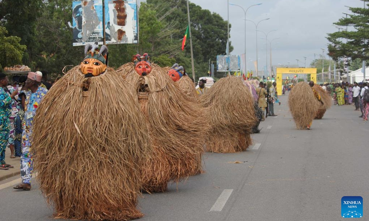 People in costumes perform in a mask parade during the Porto Novo Mask Festival in Porto Novo, Benin, Aug. 4, 2024. The festival was held here from Friday to Sunday to showcase the art and culture of Benin's traditional religion Vodun through a mask parade, concerts, seminars and other activities. (Photo: Xinhua)