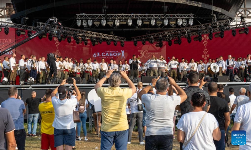 Trumpeters perform anthem of the 63rd Guca Trumpet Festival in the village of Guca, Serbia on Aug. 4, 2024. (Photo: Xinhua)