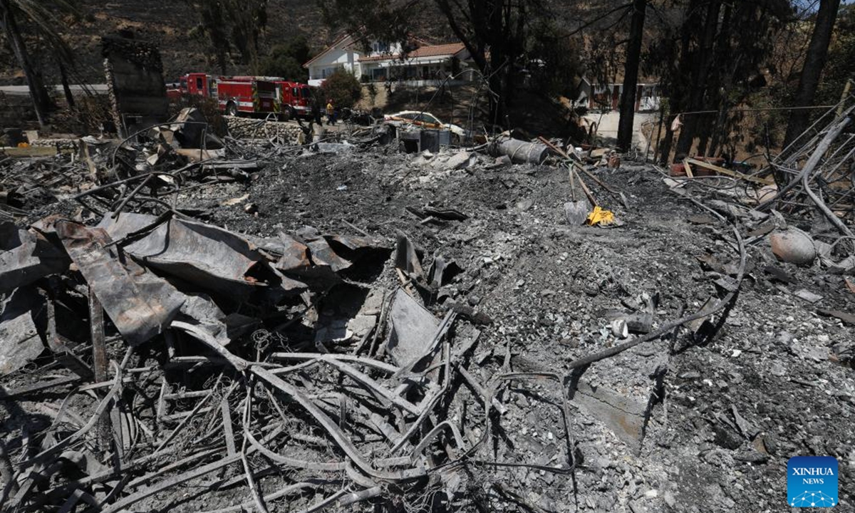 Fire trucks are seen in an area affected by a brush fire, dubbed the Edgehill Fire, in San Bernardino County, California, the United States, on Aug. 6, 2024. Multiple homes were damaged or destroyed in a fast-moving brush fire in Southern California before firefighters managed to stop its progress, authorities said on Tuesday.  (Photo: Xinhua)