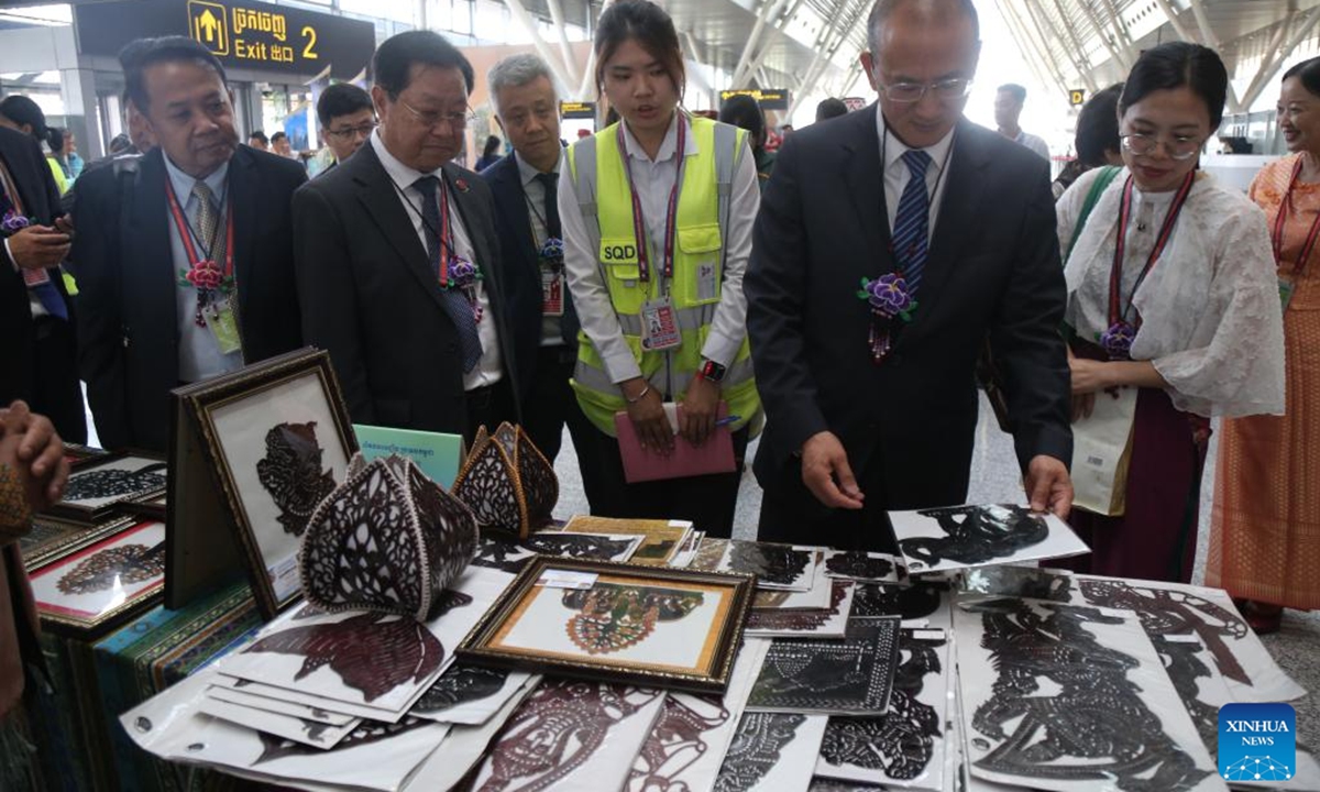 People visit a display showcasing intangible cultural heritage of southwest China's Yunnan province and Cambodia at the launching ceremony of the China-Cambodia Cultural Corridor in Siem Reap Angkor International Airport in northwest Cambodia on Aug. 6, 2024. The China-Cambodia Cultural Corridor was launched on Tuesday at Siem Reap Angkor International Airport in northwest Cambodia, a new push for the development of regional tourism. (Photo: Xinhua)