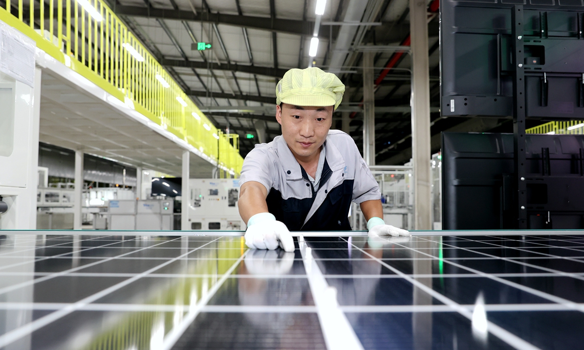 A worker at a photovoltaic panel factory in Suqian,<strong></strong> East China's Jiangsu Province, checks solar panels for export markets on August 7, 2024. In the first half of 2024, the province's foreign trade stood at 2.68 trillion yuan ($373.19 billion), up 8.5 percent year-on-year, accounting for 12.7 percent of the national total during the period. Photo: VCG