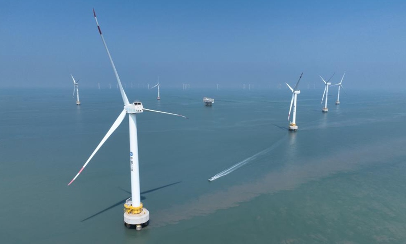 An aerial drone photo taken on Aug. 8, 2024 shows the Xinghua Bay pilot wind farm where some offshore wind turbines independently produced in Fujian Three Gorges Offshore Wind Power International Industrial Park are installed in Fuqing City, southeast China's Fujian Province. The industrial park, with a total investment of 4 billion yuan (about 557.7 million U.S. dollars), is the first full-industry-chain offshore wind power industrial park in China. (Photo: Xinhua)