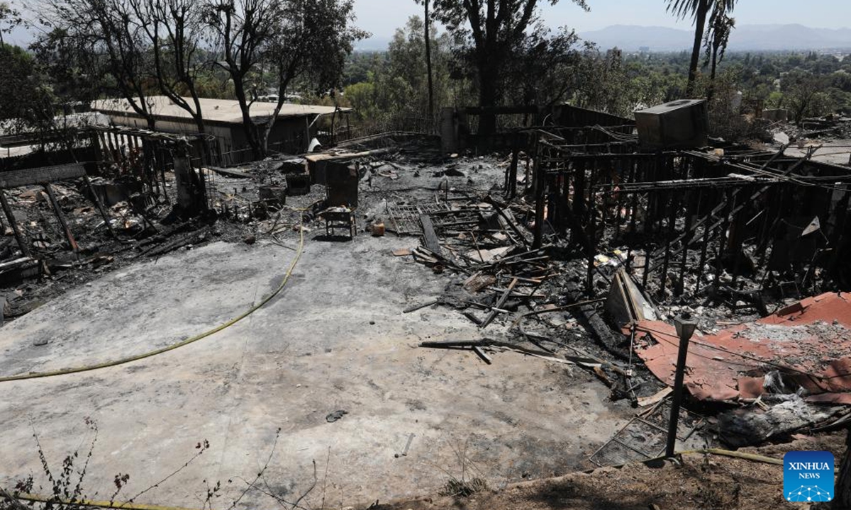 Photo taken on Aug. 6, 2024 shows a building destroyed by a brush fire, dubbed the Edgehill Fire, in San Bernardino County, California, the United States. Multiple homes were damaged or destroyed in a fast-moving brush fire in Southern California before firefighters managed to stop its progress, authorities said on Tuesday.  (Photo: Xinhua)